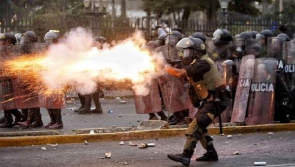 Peruvian police fire at citizens in Lima, Jan. 30, 2023.