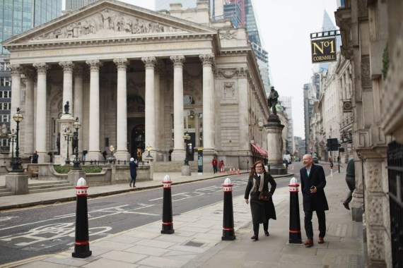 People walk by the Bank of England in London, Britain on Jan. 24, 2022.