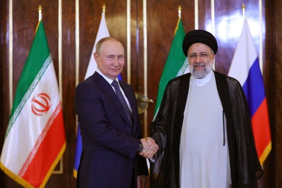 Iranian President Ebrahim Raisi (R) shakes hands with visiting Russian President Vladimir Putin (L) in Tehran, Iran, on July 19, 2022.