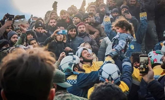 Rescuers celebrate saving a girl, Syria, Feb. 8, 2023.