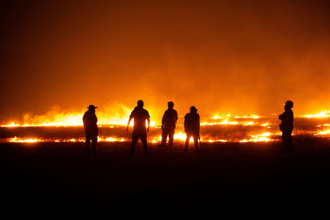 Firefighters try to put out a fire in Ercilla, Araucanía region (Chile)