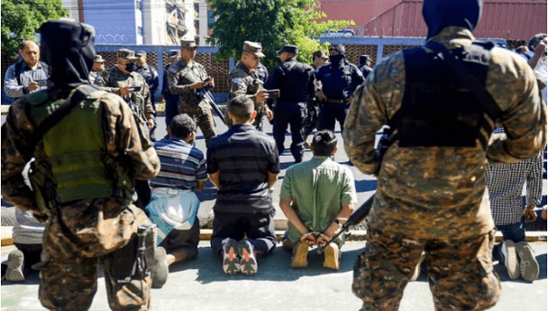 Police apprehend citizens, El Salvador. 