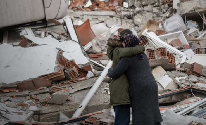 Woman finds a relative after the earthquake in Syria, Feb. 2023.