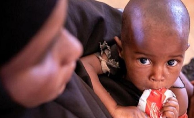 Somali boy receives food assistance, 2023.