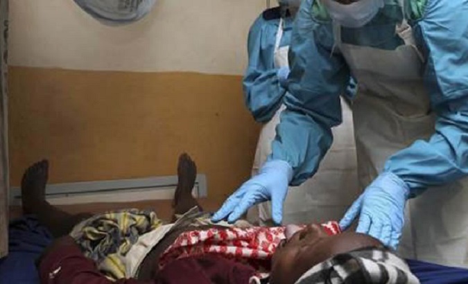 Health worker attends to a Lassa fever patient.