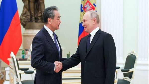 Wang Yi (L) and Vladimir Putin (R), Moscow, Russia, Feb. 22, 2023.