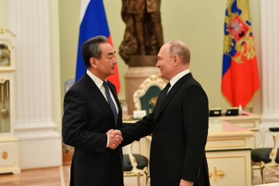 Russian President Vladimir Putin meets with Wang Yi, a member of the Political Bureau of the Communist Party of China (CPC) Central Committee and director of the Office of the Foreign Affairs Commission of the CPC Central Committee, in Moscow, Russia, Feb. 22, 2023.