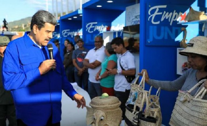Venezuela's President Nicolas Maduro (L) at a tourism business fair, Feb. 23, 2023.
