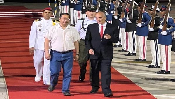 President Luis Arce (L) arrives in Venezuela to take part in the initiatives to remember the 10th anniversary of Commander Hugo Chavez, Caracas, Venezuela, March 4, 2023.