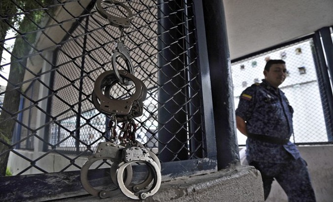 An officer guards a prison cell, Colombia.