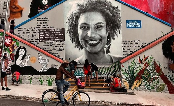 Brazilians place offerings on stairs painted in memory of Marielle Franco, 2023.