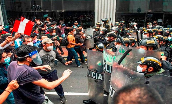 Police officers repress anti-government protesters, Peru.