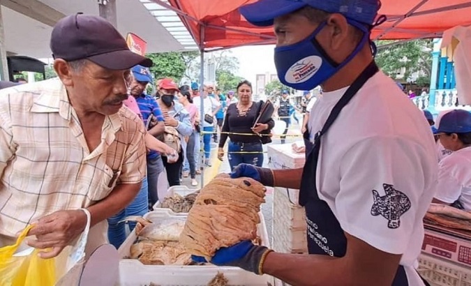 People at a fish market in Venezuela, April 11, 2023.