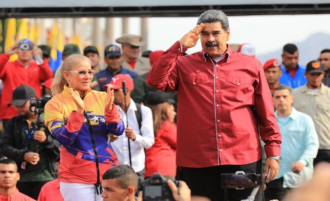 Venezuelan President Nicolas Maduro (R) and Lawmaker Cilia Flores (L).