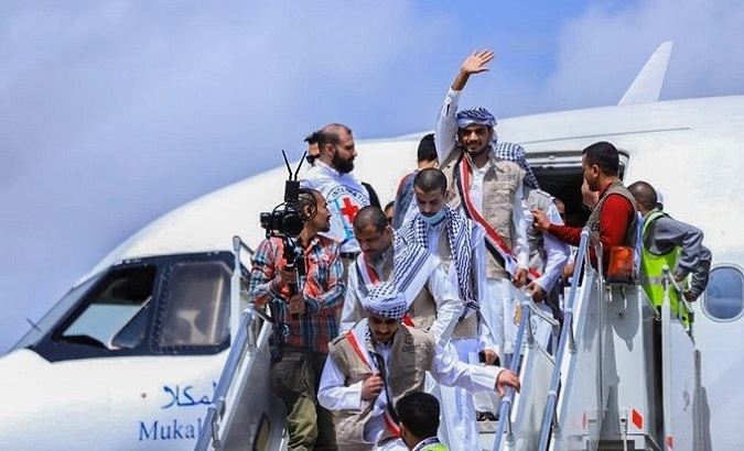 Houthi militants descend from a Red Cross plane after being released, April, 2023.