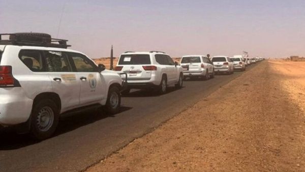 UN car caravan leaving Sudan, April 24, 2023.