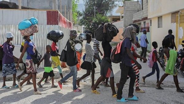 Haitian people flee gang-related violence, 2023. 