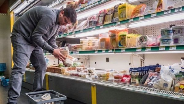 A man buying food in an EU country, 2023.