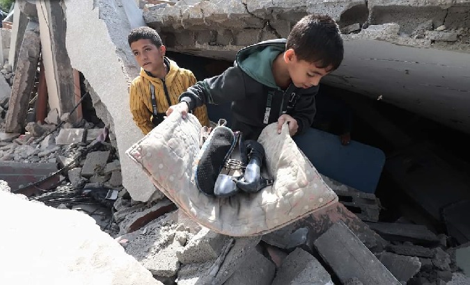 Palestinians turn over the rubble of their homes in search of some things, May 14, 2023.