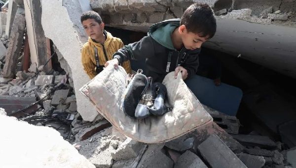 Palestinians turn over the rubble of their homes in search of some things, May 14, 2023.