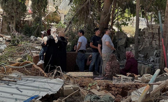 Palestinian families are left out in the open after the demolition of their residence, May 17, 2023.