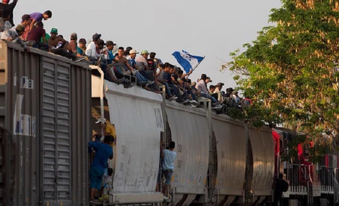 A train filled with migrants heads toward the U.S. border, Sept. 20, 2023.