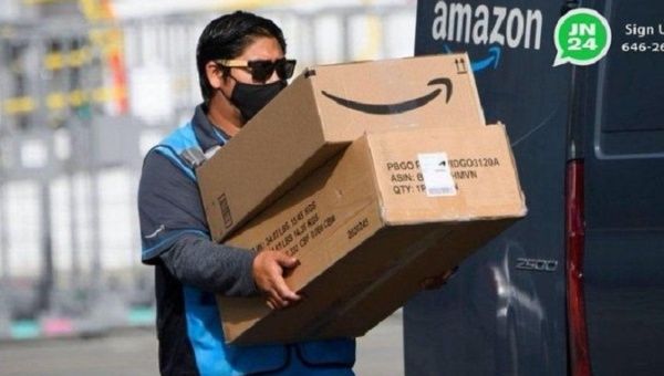 Worker delivering Amazon products.