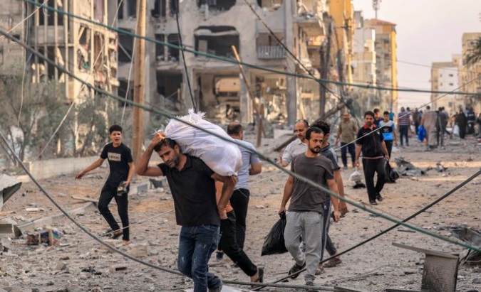 Palestinians wander the streets after Israeli bombings of Gaza, Oct. 11, 2023.