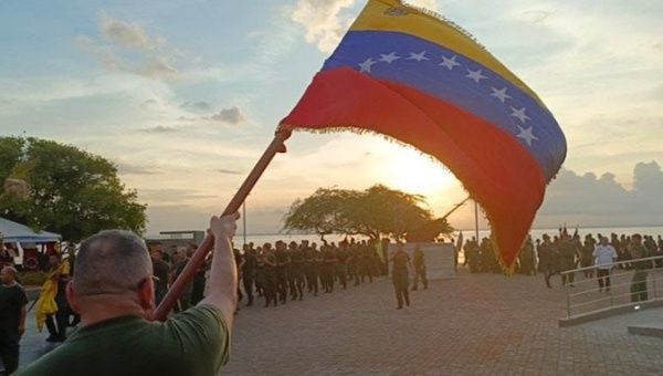 A view of the Venezuelan flag and soldiers.