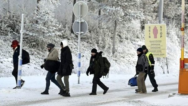 Migrants at a crossing on the Finnish border, Nov. 23, 2023.