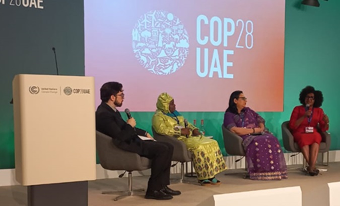 People at a meeting on climate finance strategies, Dubai, UAE, Dec. 5, 2023.