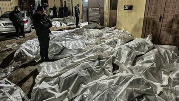 Bodies collected by authorities after the Israeli bombing of Al-Maghazi, Dec. 24, 2023.