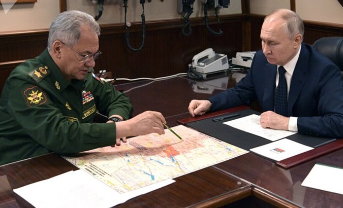 Russian Defense Minister Sergei Shoigu (L) and President Vladimir Putin, Dec. 26, 2023.