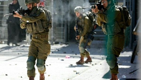 Israeli soldiers target civilians during the assault on Al-Fawwar camp, Dec. 29, 2023.