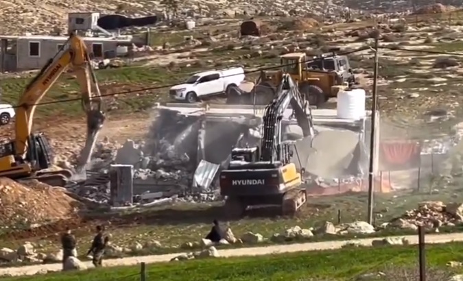 Israeli settlers wielding rifles and machetes burned Palestinian homes, Dec. 27, 2023.