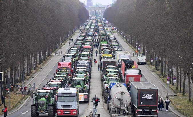 German farmers block traffic towards Berlin's Brandenburg Gate, Jan. 15, 2024.