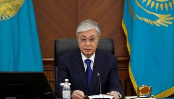 Kazakh President Kassym-Jomart Tokayev signs a decree accepting the resignation of his country’s government Feb. 5, 2024. 