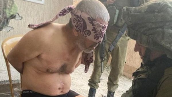 Elderly Palestinian Hussein al-Masri is interrogated by Israeli forces after arbitrarily arresting him, Feb. 19, 2024.