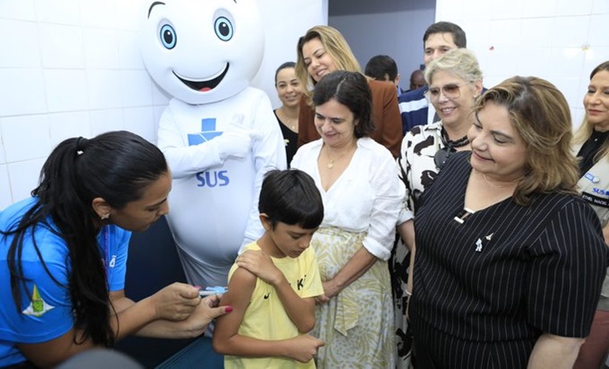 Child receives an anti-dengue vaccine in Brazil, Feb.