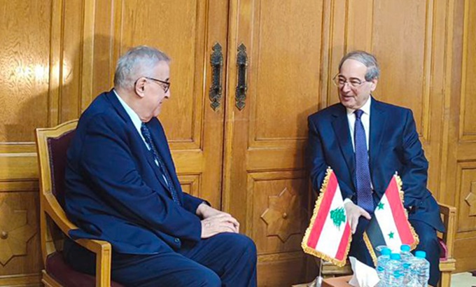 Minister for Foreign Affairs and Expatriates of Syria, Faisal Al-Mekdad(L) and his homologue from Lebanon Abdullah Bou Habib(R).