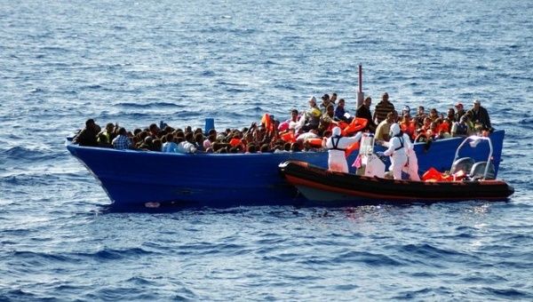 Migrants at the Mediterranean Sea, 2024.