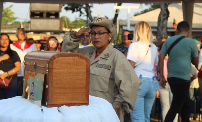 Bolivarian militiawoman greets the remains of the pro-independence heroines, March 8, 2024.