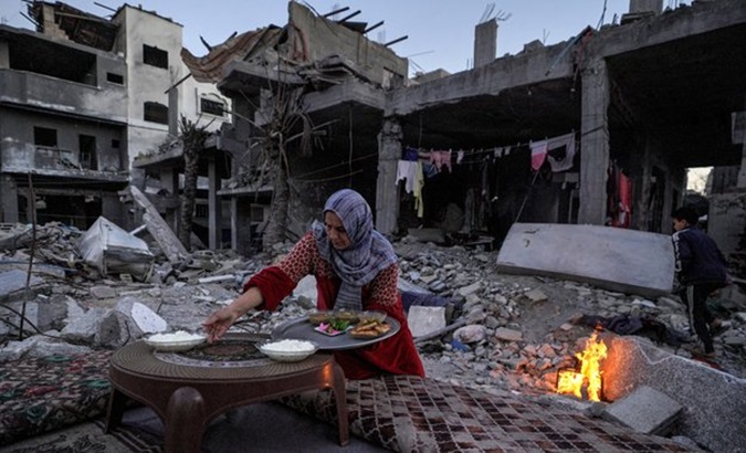 A Palestinian woman preparing food in Gaza, March, 2024.