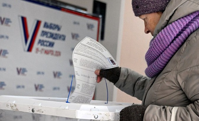 A Russian woman casts her vote, March 15, 2024.