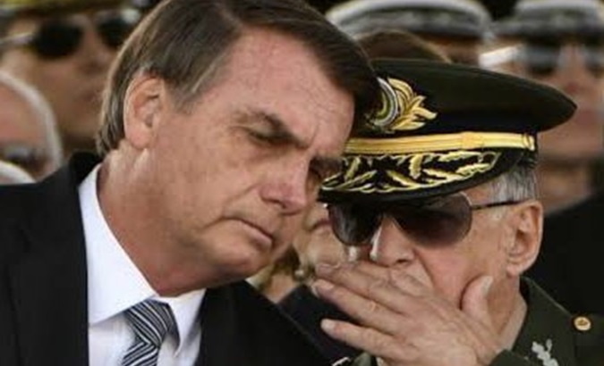 Former Brazilian President Jair Bolsonaro (L).