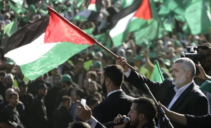 People waving Palestinian flags.