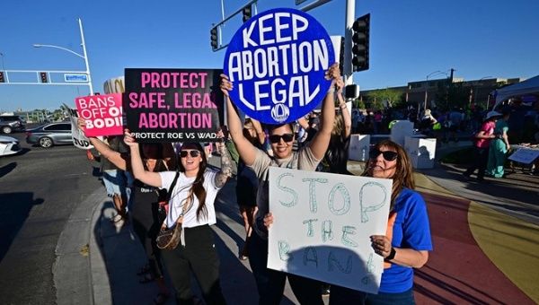 Pro-abortion rights demonstrators rally in Scottsdale, Arizona, April 15, 2024.