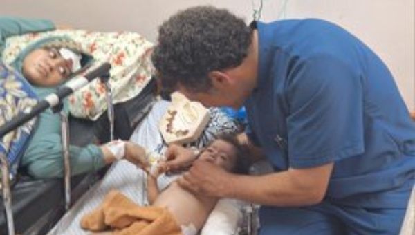 Doctor attending to a little child in Gaza, May 2024