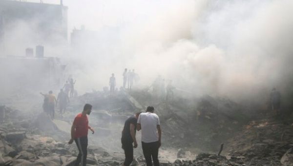 Civilians amid the smoke and destruction in Gaza, May 15, 2024