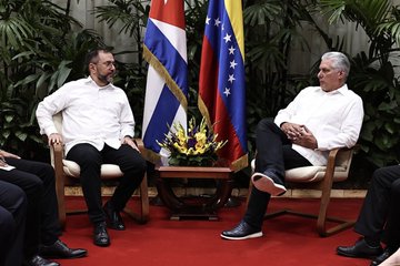 Minister Yvan Gil (R) in the meeting with the President Diaz-Canel (L)
